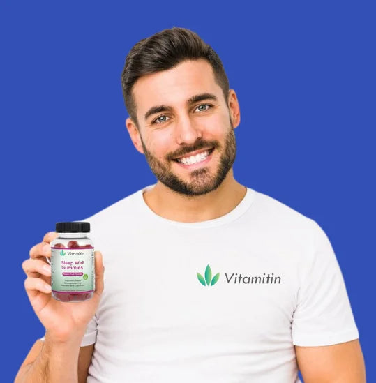 A smiling boy holding a vitamitin bottle